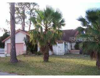635 Duke Road Venice, FL 34293 - Photo 1 of 1 a backyard of a house with lots of green space