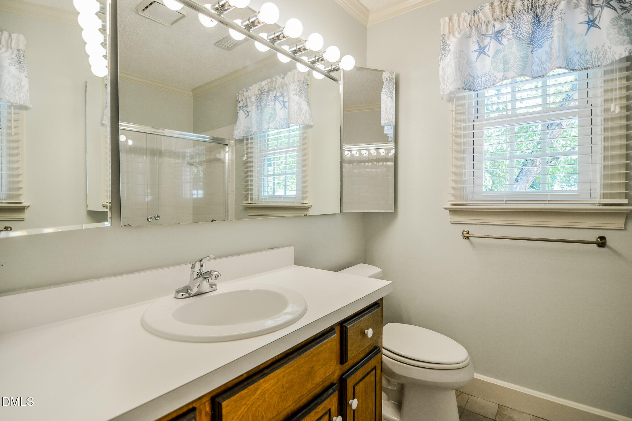 1215 Cambridge Road Northwest Wilson, NC 27896 - Photo 48 of 54 a bathroom with a sink toilet and a mirror