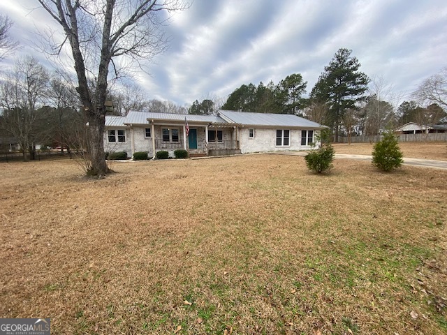 1270 Village Road Elberton, GA 30635 - Photo 1 of 1 a view of a house with a yard covered in snow
