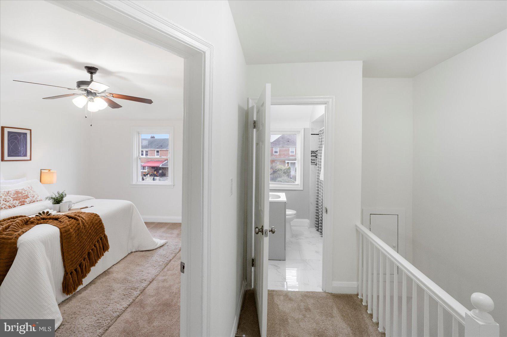 1324 Winston Avenue Baltimore, MD 21239 - Photo 23 of 33 a bedroom with a bed and a chandelier