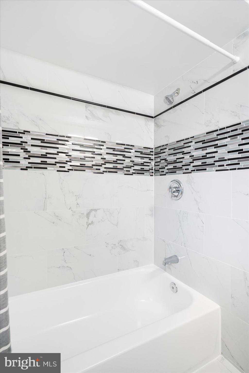 1324 Winston Avenue Baltimore, MD 21239 - Photo 25 of 33 a bathroom with a bathtub and shower