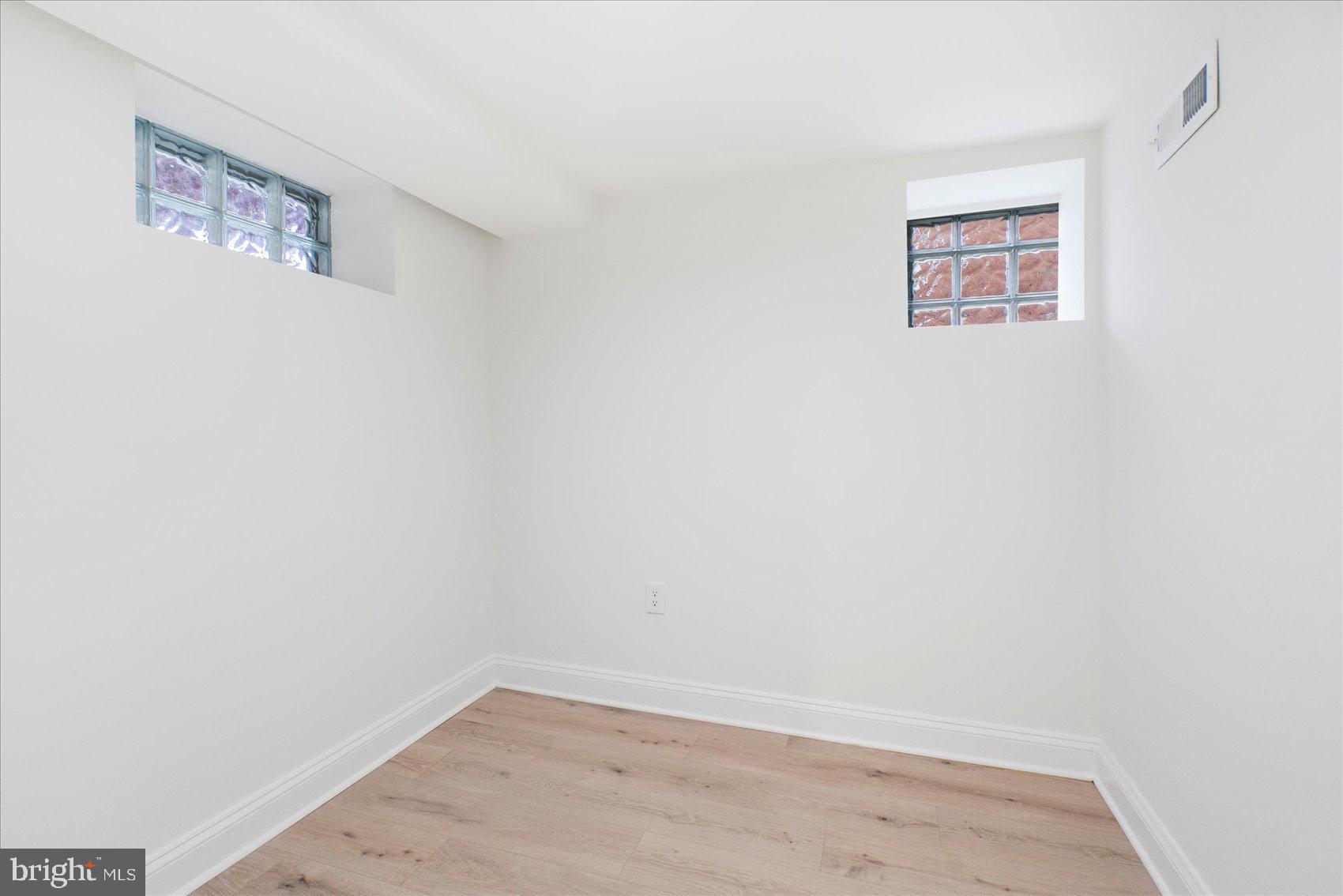 1324 Winston Avenue Baltimore, MD 21239 - Photo 30 of 33 an empty room with a hallway