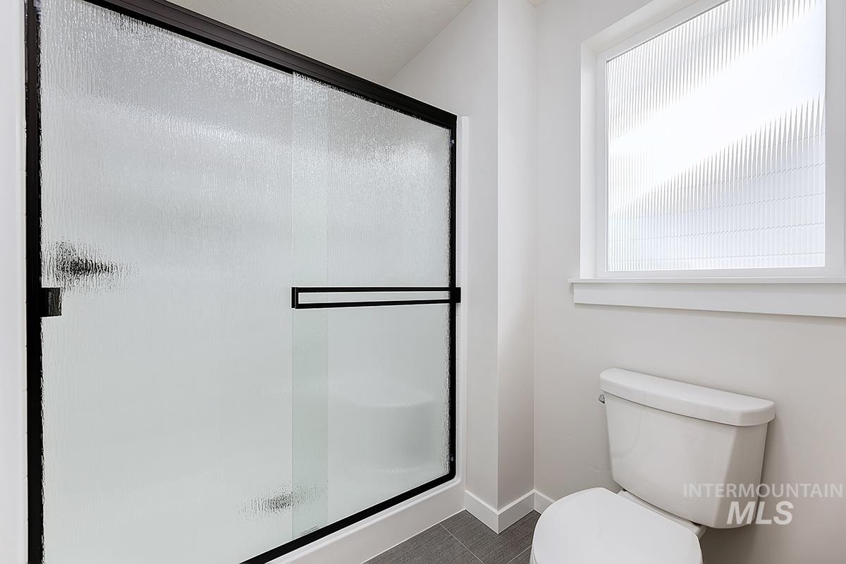 1700 East Hadler Street Meridian, ID 83642 - Photo 12 of 25 Bathroom with a stall shower and toilet