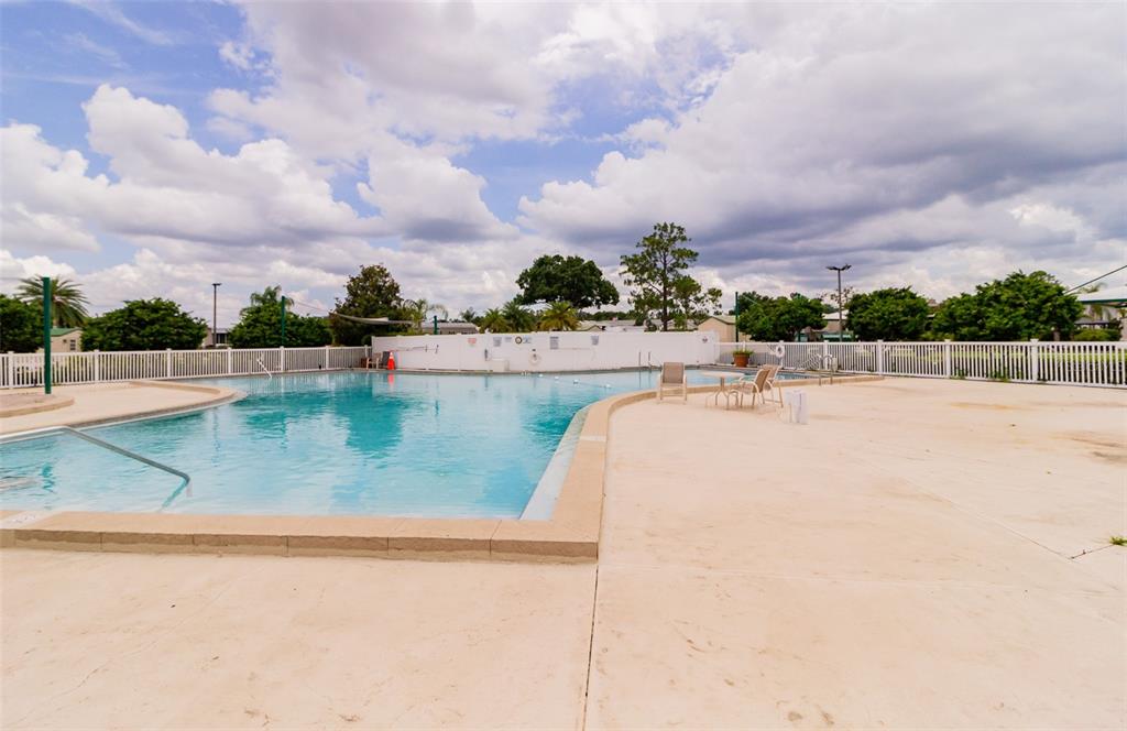 16357 Cherry Tree Court Clermont, FL 34714 - Photo 20 of 27 a view of swimming pool with a yard