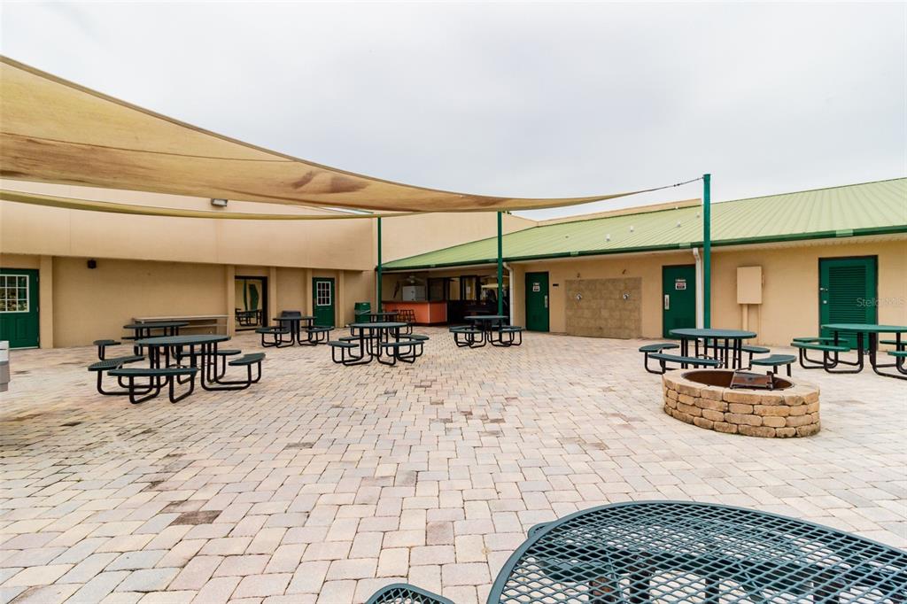 16357 Cherry Tree Court Clermont, FL 34714 - Photo 24 of 27 a view of a dinning table and chairs in patio of the house