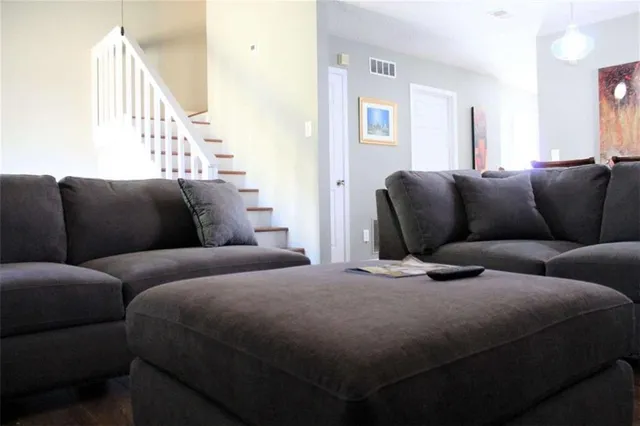 a bed room with two bed and a couch