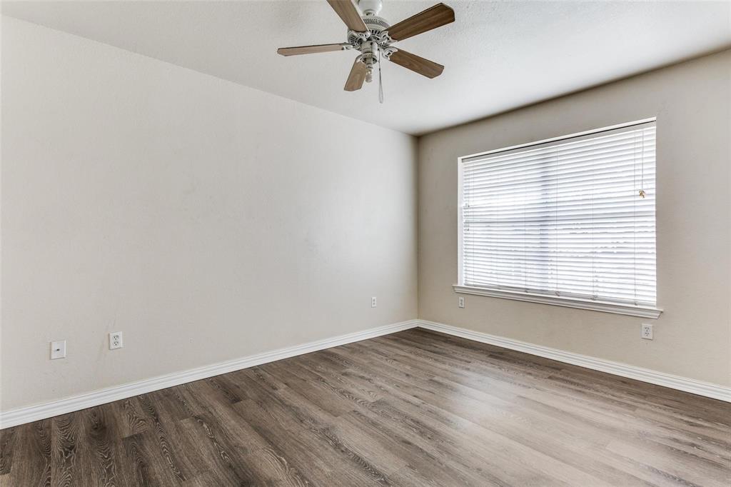 1008 Treys Court Sanger, TX 76266 - Photo 10 of 11 Unfurnished room featuring wood finished floors and ceiling fan