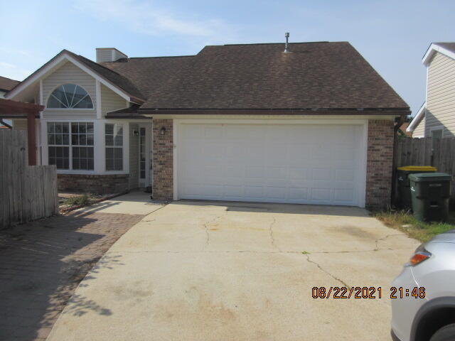 404 Adam Street Northwest Fort Walton Beach, FL 32548 - Photo 1 of 25 a front view of a house with a yard