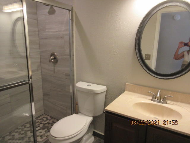 404 Adam Street Northwest Fort Walton Beach, FL 32548 - Photo 14 of 25 a bathroom with a sink a toilet and a mirror