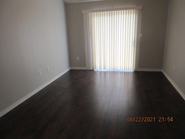404 Adam Street Northwest Fort Walton Beach, FL 32548 - Photo 16 of 25 an empty room with wooden floor and windows