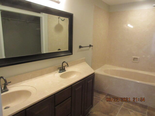 404 Adam Street Northwest Fort Walton Beach, FL 32548 - Photo 17 of 25 a bathroom with a sink and a mirror