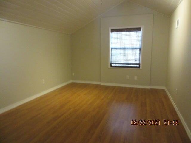 404 Adam Street Northwest Fort Walton Beach, FL 32548 - Photo 20 of 25 an empty room with wooden floor and windows