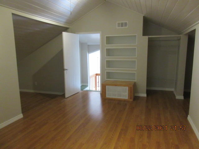 404 Adam Street Northwest Fort Walton Beach, FL 32548 - Photo 22 of 25 a view of an empty room with wooden floor and closet