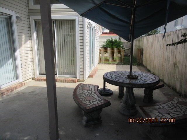 404 Adam Street Northwest Fort Walton Beach, FL 32548 - Photo 24 of 25 a view of a balcony with table and chairs