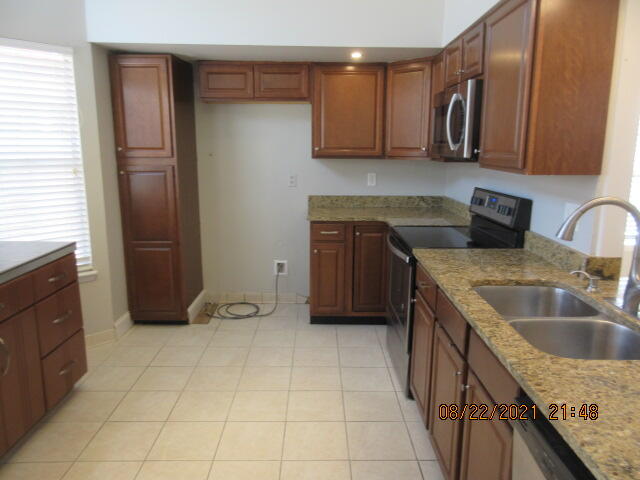 404 Adam Street Northwest Fort Walton Beach, FL 32548 - Photo 4 of 25 a kitchen with a sink stove and cabinets