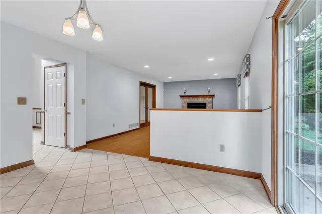 a view of a kitchen with an empty space and a window