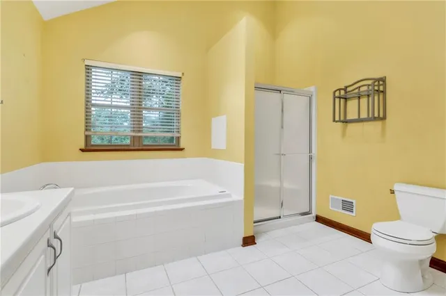 a bathroom with a sink a bathtub and a toilet