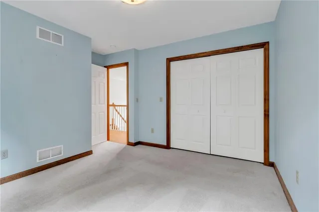 a view of empty room with windows