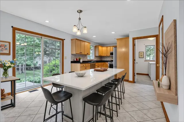 a view of a dining room with furniture window and outside view