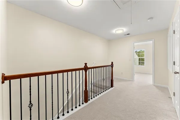 a view of a hallway with windows