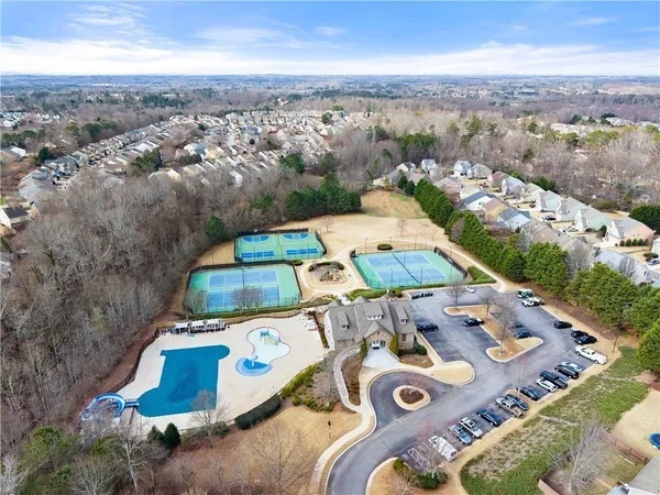 an aerial view of a house with outdoor space