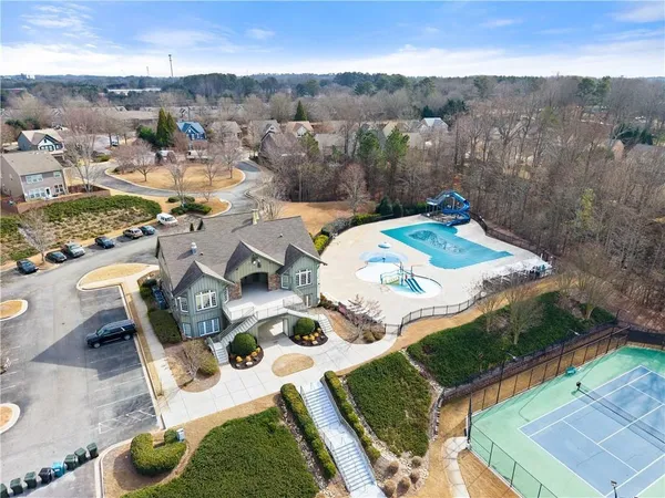 an aerial view of residential houses with outdoor space