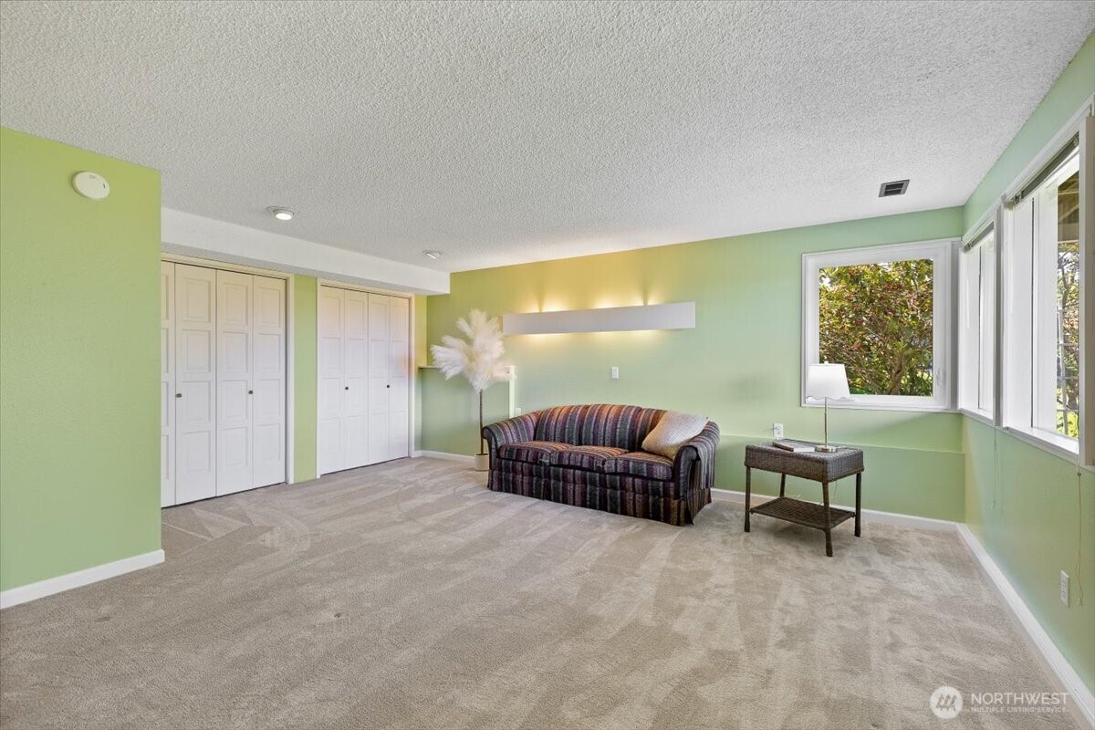 2606 49th Place Southwest Everett, WA 98203 - Photo 22 of 37 a bedroom with furniture and a window