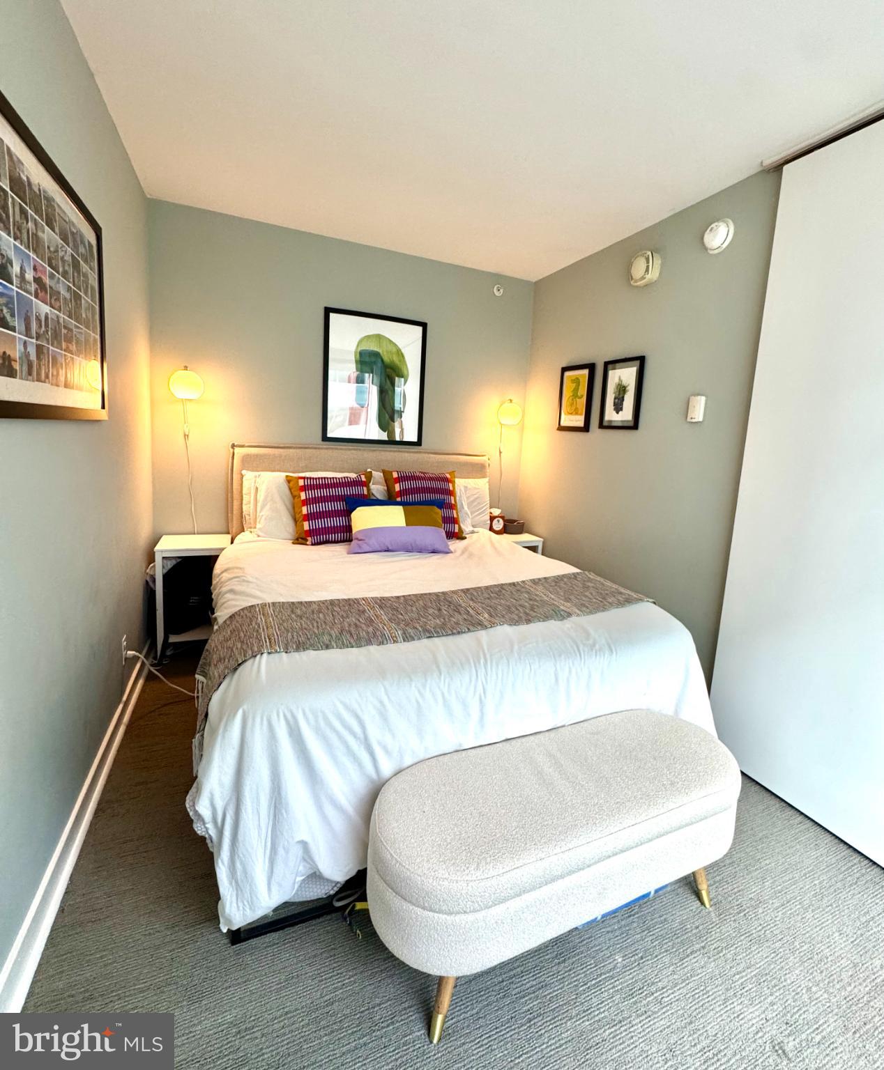 1101 3rd Street Southwest, Unit 509 Washington, DC 20024 - Photo 12 of 28 a bedroom with a bed and night stand