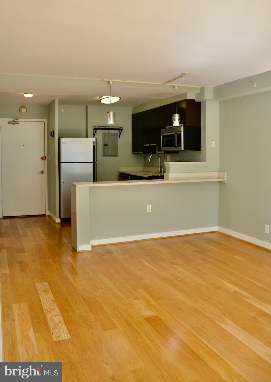 1101 3rd Street Southwest, Unit 509 Washington, DC 20024 - Photo 23 of 28 a view of a livingroom with furniture and a flat screen tv