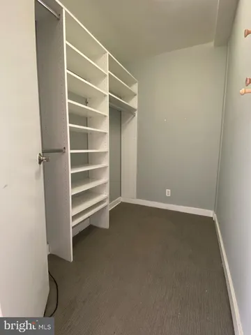 an empty room with a empty space and a window