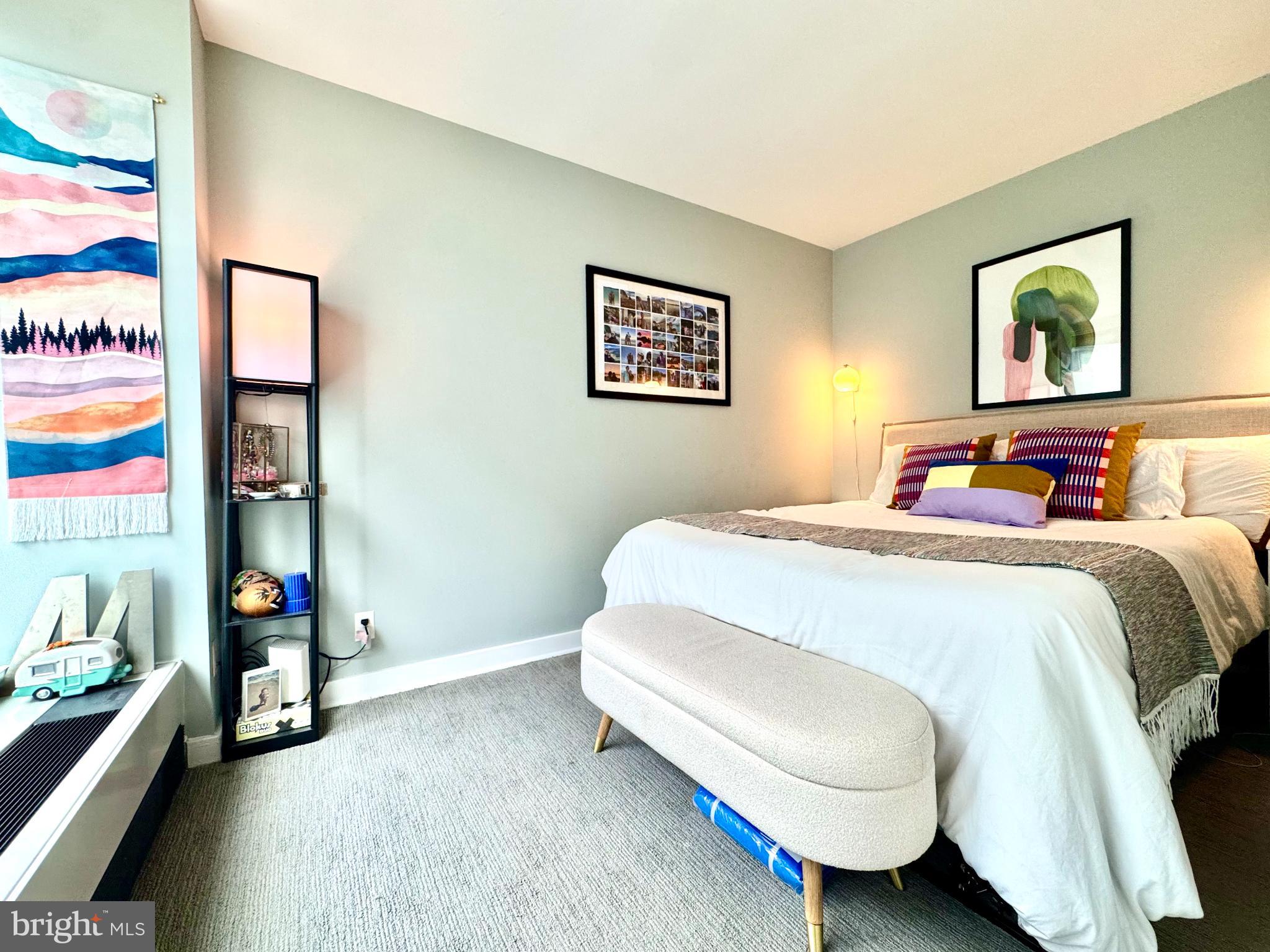 1101 3rd Street Southwest, Unit 509 Washington, DC 20024 - Photo 9 of 28 a bedroom with a bed and a desk