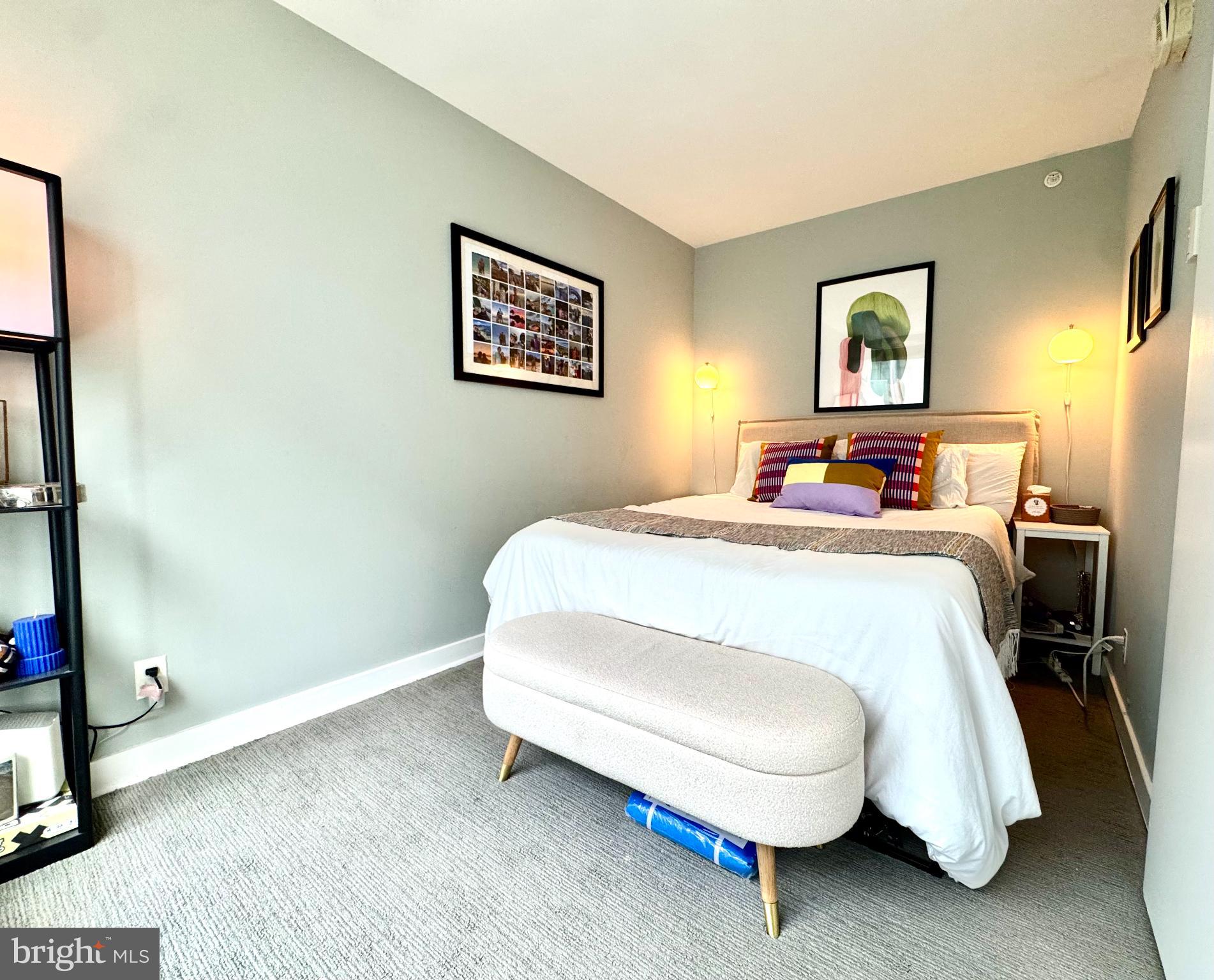1101 3rd Street Southwest, Unit 509 Washington, DC 20024 - Photo 10 of 28 a bedroom with a bed and a night stand