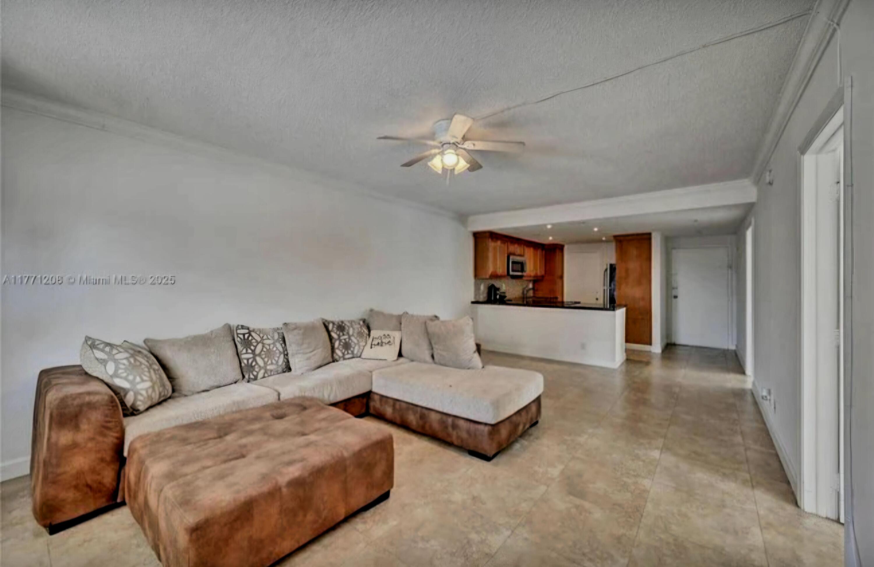 200 South Birch Road, Unit 208 Fort Lauderdale, FL 33316 - Photo 16 of 22 a living room with furniture and a ceiling fan