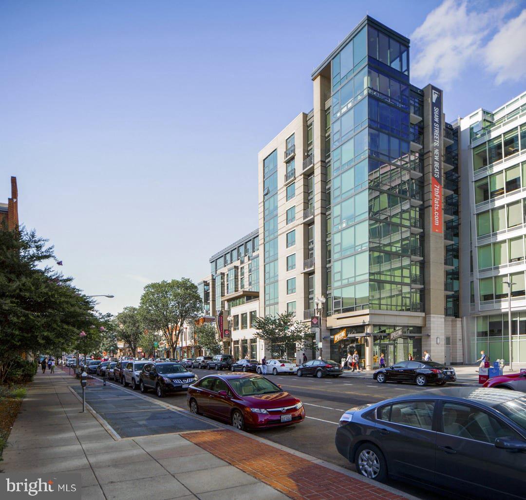 1825 Northwest 7th Street Northwest, Unit 2 BR 2 Washington, DC 20001 - Photo 1 of 9 a city street lined with buildings and cars
