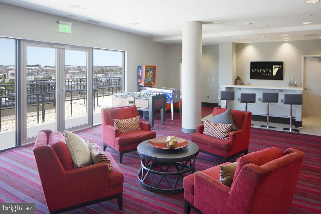 1825 Northwest 7th Street Northwest, Unit 2 BR 2 Washington, DC 20001 - Photo 7 of 9 a living room with furniture and a wooden floor