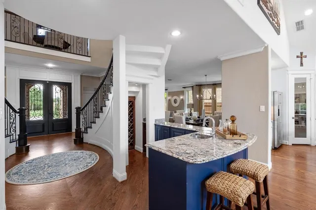 a dining room with furniture and wooden floor