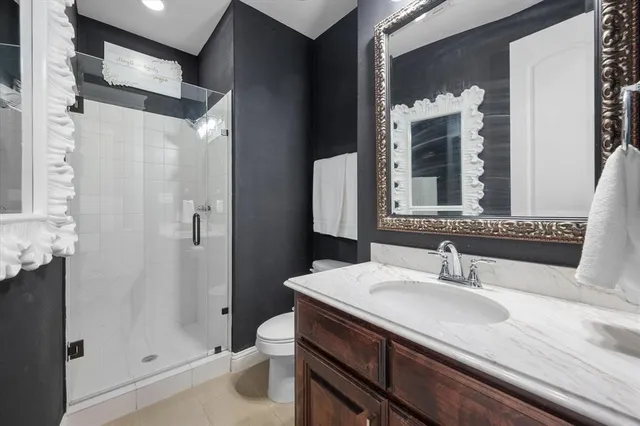 a view of a dining room with furniture and a window
