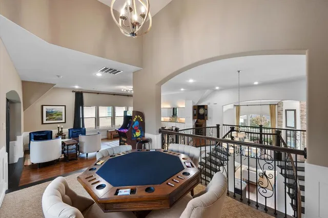 a living room with furniture and kitchen view