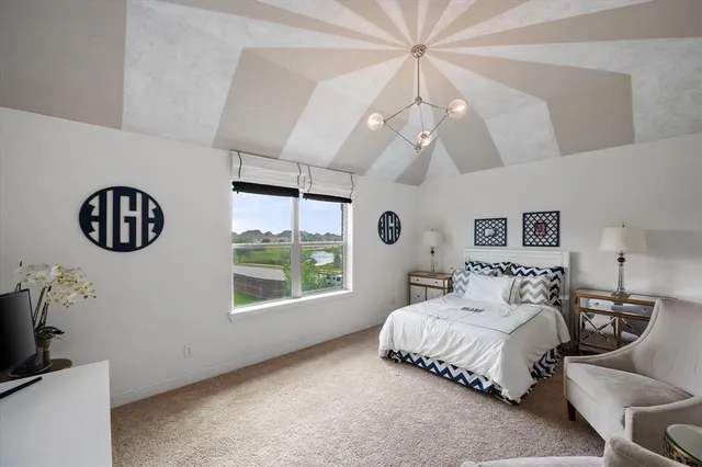 a view of a lake with a houses in the background