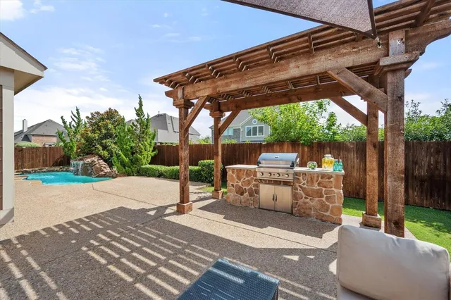 a backyard of a house with yard and outdoor seating