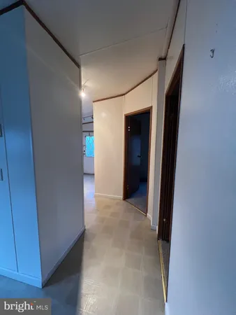 a view of hallway with closet