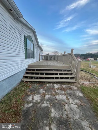 a view of a backyard with sitting area
