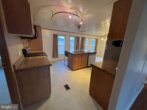 a view of living room with furniture and a window