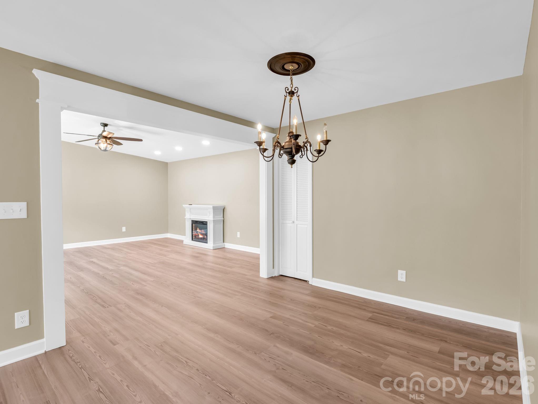 44 Jervey Road, Unit 4C Tryon, NC 28782 - Photo 11 of 35 a view of a room with a chandelier and wooden floor