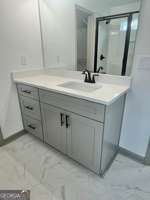 315 Ash Street Monroe, GA 30655 - Photo 12 of 21 a bathroom with a sink and a mirror