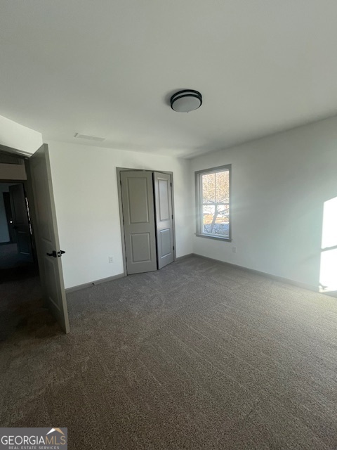 315 Ash Street Monroe, GA 30655 - Photo 13 of 21 a view of an empty room and window