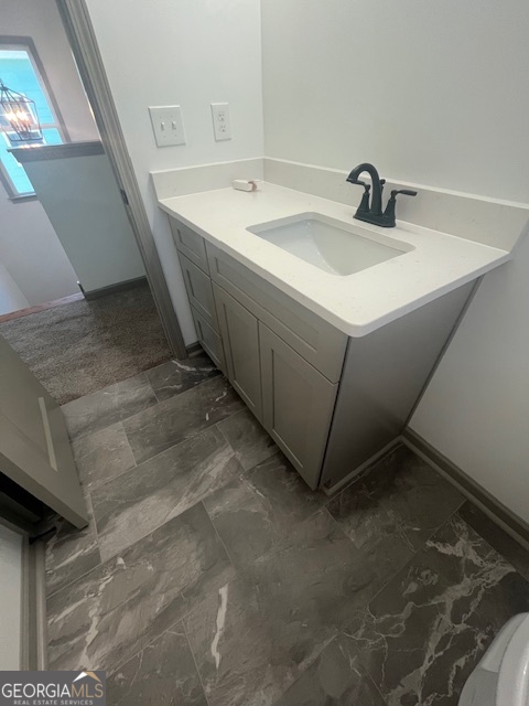 315 Ash Street Monroe, GA 30655 - Photo 15 of 17 a bathroom with a sink and a mirror
