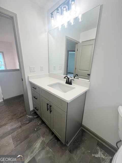 315 Ash Street Monroe, GA 30655 - Photo 20 of 21 a utility room with a sink a vanity and a mirror