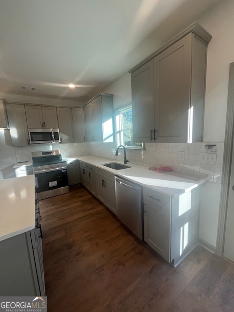 315 Ash Street Monroe, GA 30655 - Photo 8 of 17 a kitchen with stainless steel appliances granite countertop a sink stove and refrigerator