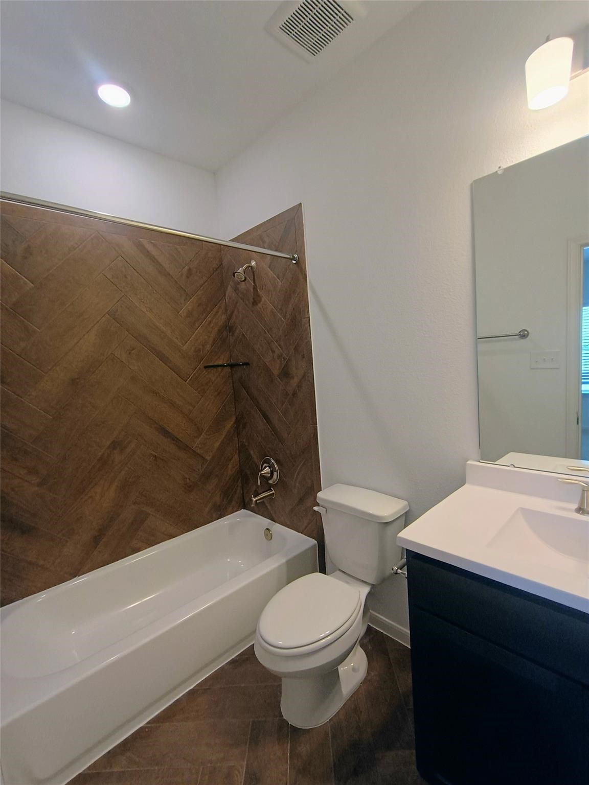 15924 Cy Young Court Splendora, TX 77372 - Photo 24 of 29 a bathroom with a toilet a sink and bathtub